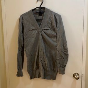 Gently worn sweater by bench